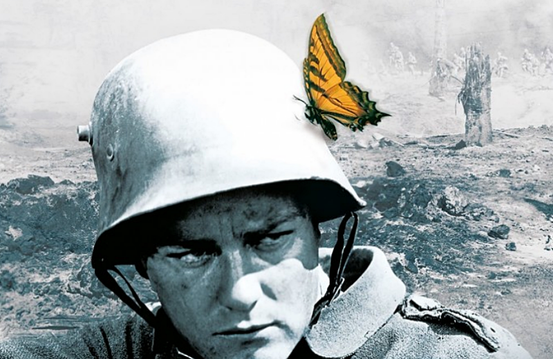 A butterfly has perched itself to an army soldier's helmet.