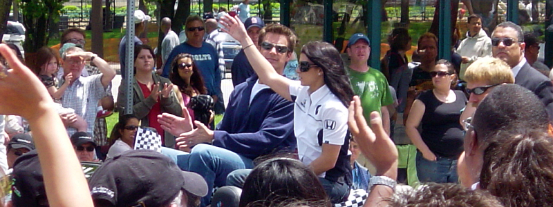 Danica Patrick waves to a crowd.