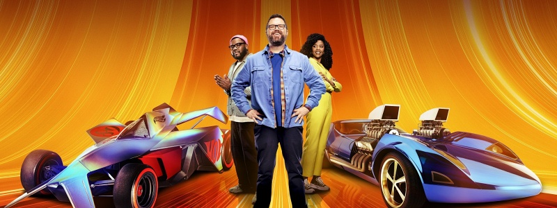 Hertrech Eugene Jr., Rutledge Wood and Dalal Elsheikh standing in front of two life-size Hot Wheels cars