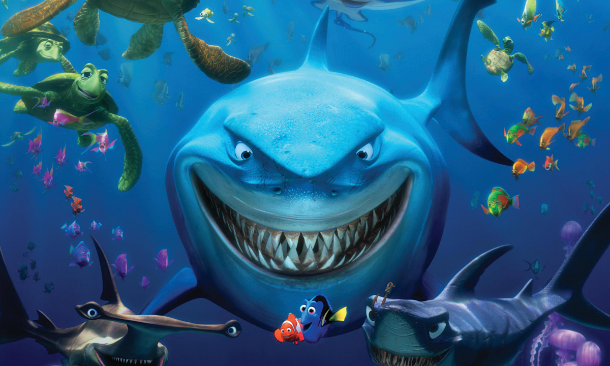 Two little fish and a large shark behind them