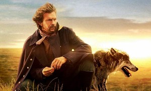 Kevin Costner pondering with his dog by his side in Dances with Wolves