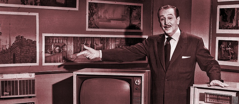 Walt Disney standing in his office.