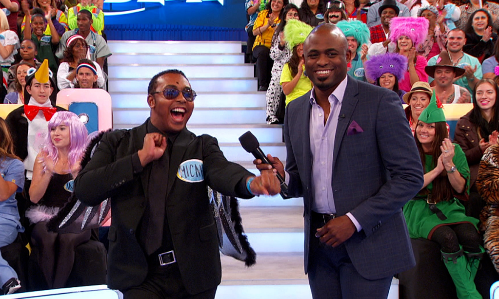 Host Wayne Brady on the set of "Let's Make a Deal" with a contestant