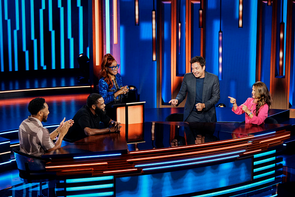 Contestants and host for the game show "Password"