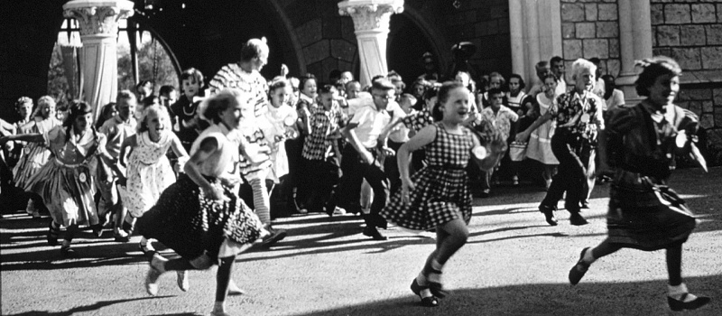 Many children running in Disneyland on opening day