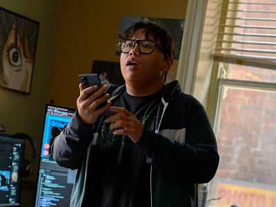 A man tries out his new app on his phone