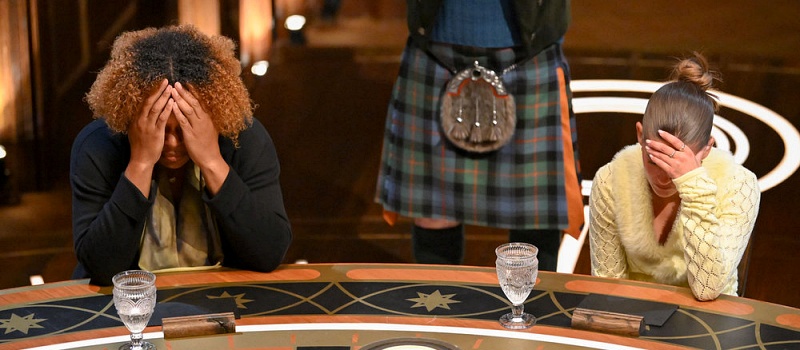 Two women hide their faces in an episode of "The Traitors: New Blood"